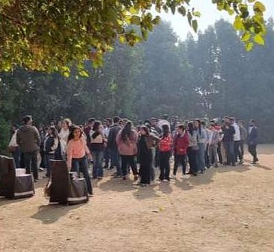 Outdoor group activity under trees during the EY offsite