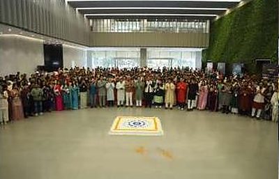 Large employee group photograph around the rangoli at the Hyundai Diwali celebration