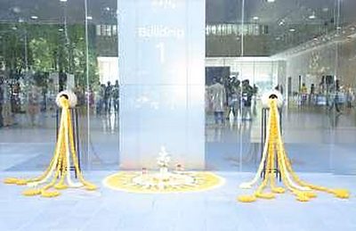 Marigold and diya rangoli installation in the Hyundai office atrium