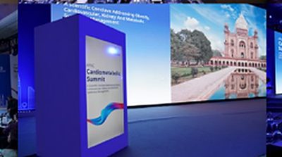 Illuminated brand cube and screen in the summit foyer
